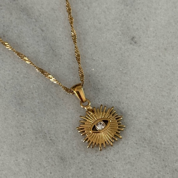 Modest Lu Jewelry - COPY - Gold Sun Burst Evil Eye Crystal Pendant Necklace 

Brand New